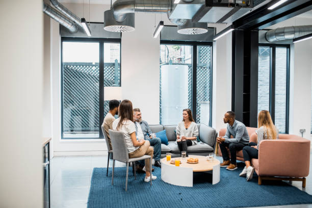 istock Colleagues discussing new plans in a board room 937245276