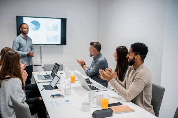 istock Businesspeople clapping to their colleague after his presentation 937245278