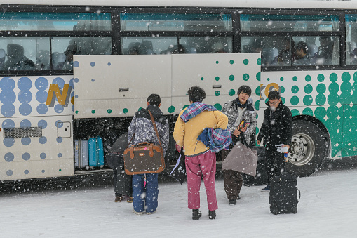 February 21, 2018, Madarao, Japan: People are seen getting their luggages from a bus in Madarao, Japan.