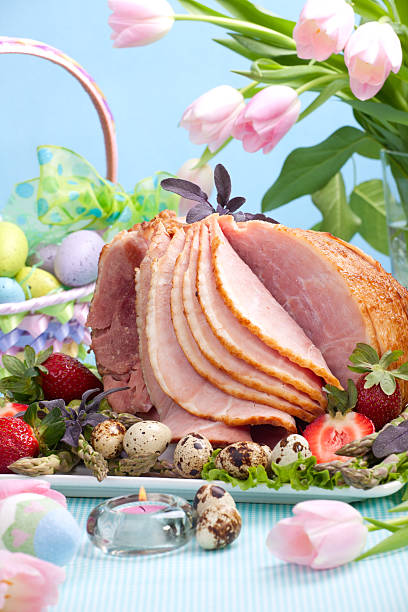 istock Holiday ham with fruit, tulips, and Easter basket  93725376
