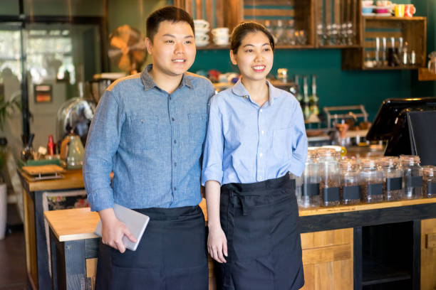 istock Ambitious Asian couple running own cafe 937254484