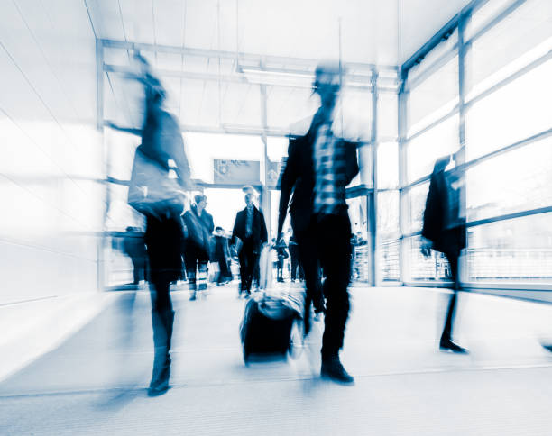istock blurred crowd of people 937257656