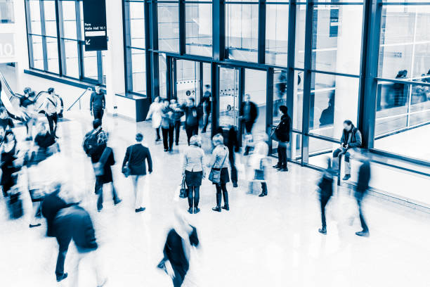 istock blurred crowd of people 937257662