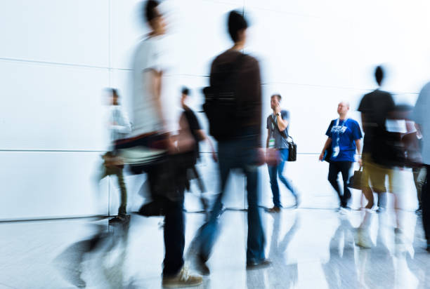 istock blurred crowd of people 937257742