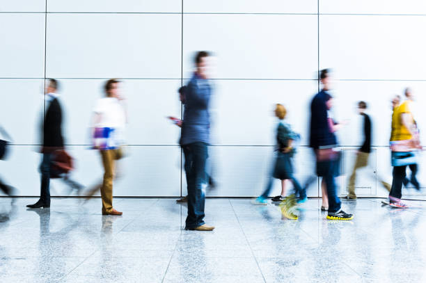 istock blurred crowd of people 937257762