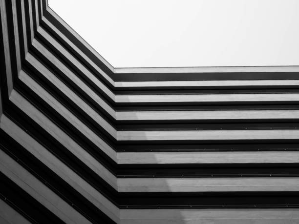 istock Looking up to sky from modern concrete building,Abstract layer of architecture 937261104