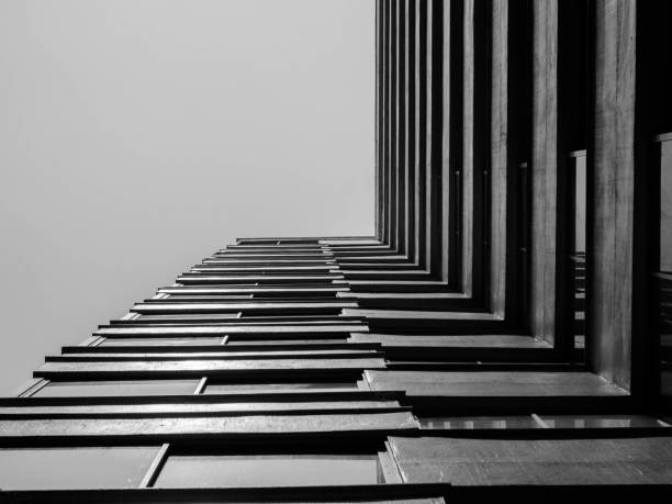 istock Looking up to sky from modern concrete building,Abstract layer of architecture 937261112