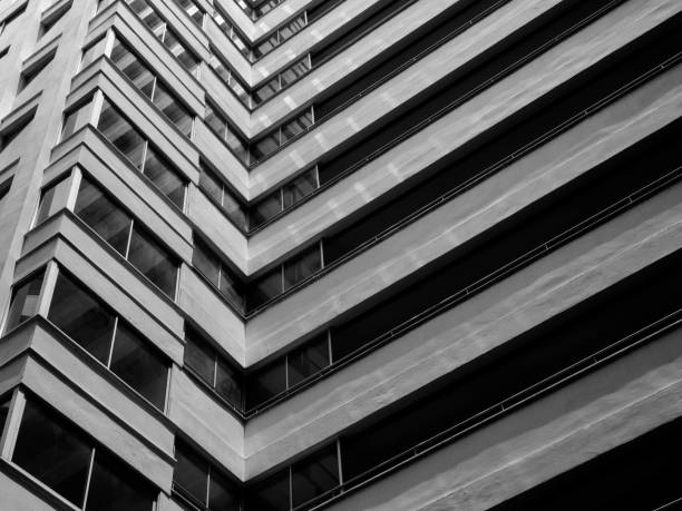 istock Looking up to sky from modern concrete building,Abstract layer of architecture 937261116
