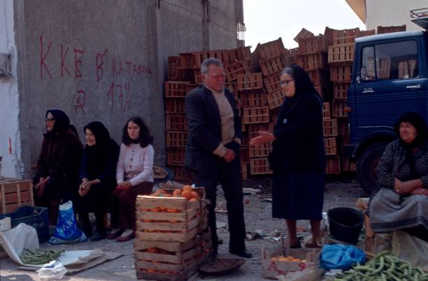Crete, Greece, 1981. Greek peasant women offer and sell their products at a market in Crete.
