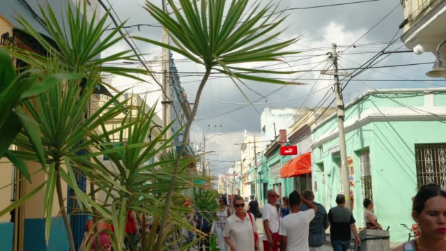 Some tourists and locals in the center of Camaguey, Cuba