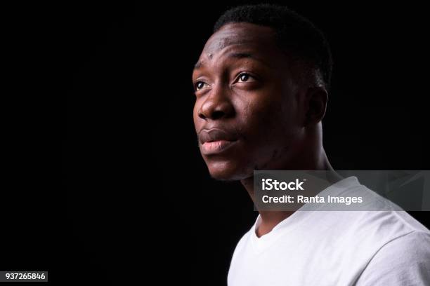 Portrait Of African Man Stock Photo - Download Image Now - Men, Black Background, Portrait