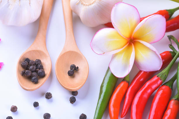 Asian ingredients food fresh spices Vegetable (tomato, chilli, garlic, pepper, plumeria) close up.