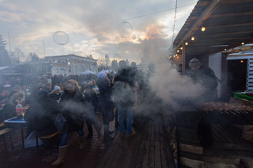 Kiev: Townspeople and counter with street food at the celebration of Shrovetide