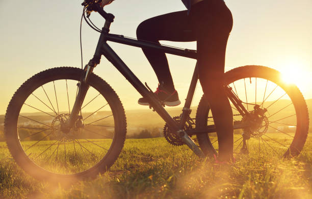 istock Cyclist on a bicycle in the sunset. 937270366