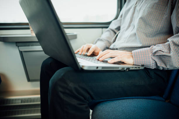 istock Businessman working and traveling by train 937271594