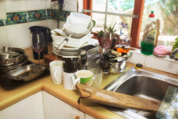 istock Pile of dirty dishes ready to be washed 937275434