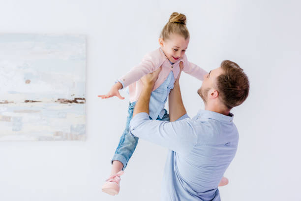 istock Young father playing with child girl 937275552