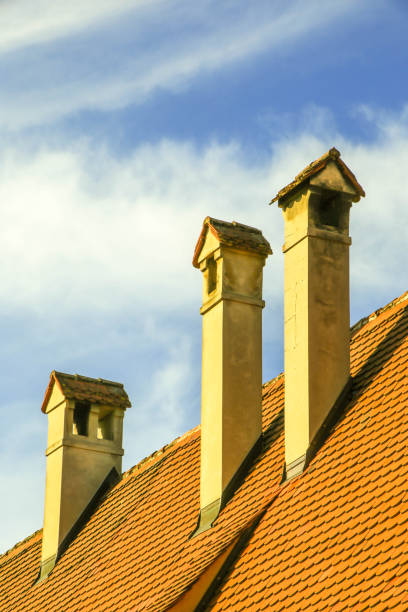 istock Red roof with three chimneys 937278488