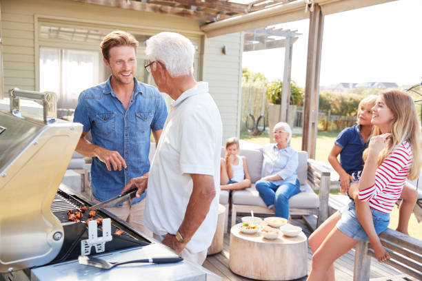 istock Multi Generation Family Enjoying Cooking Barbecue At Home 937278880