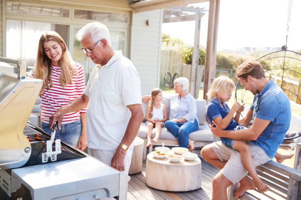 istock Multi Generation Family Enjoying Cooking Barbecue At Home 937278882