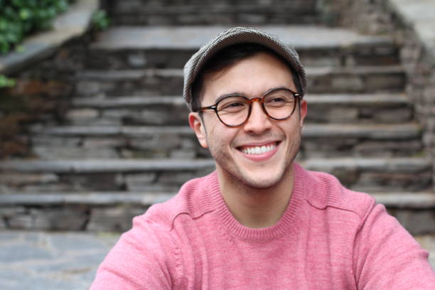 istock Hip man smiling wearing eyeglasses and hat 937279686