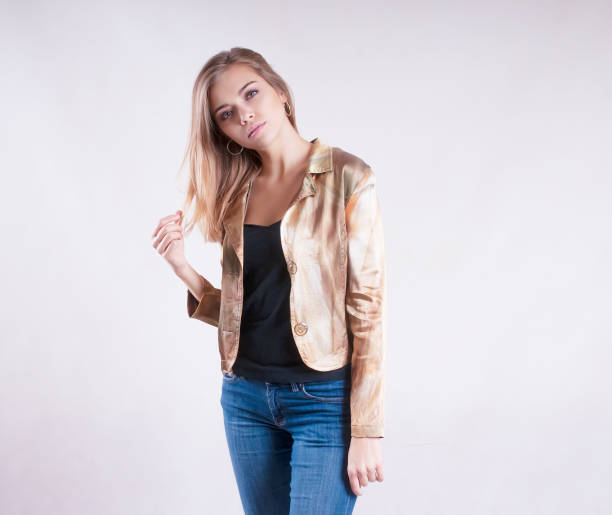 istock young girl in a jacket and jeans studio 937282068