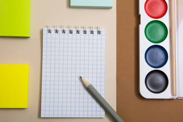 istock Notepad with pencil sticky paper for snakes and watercolor paints 937282226