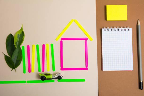 istock House of counting machine sticks and a notebook with a pencil 937282230