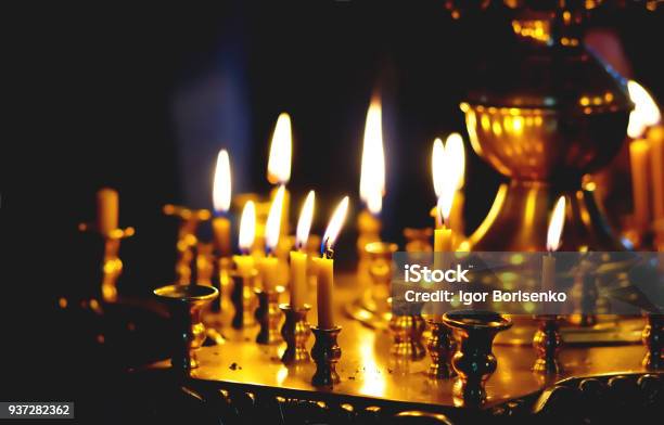 Burning Candles In The Church As A Sign Of Repentance And Mercy Before God Stock Photo - Download Image Now