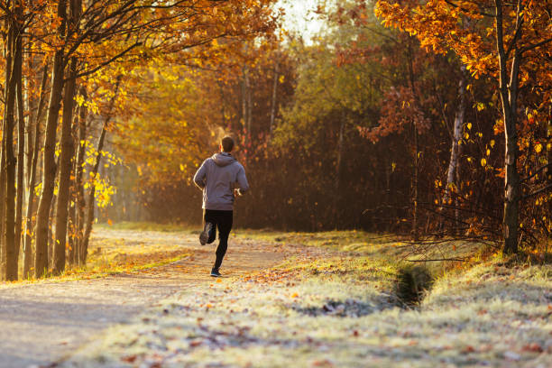 Man running outdoors on cold autumn morning