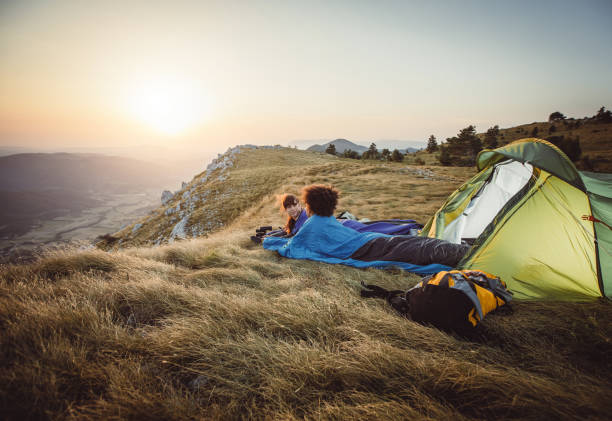 istock Two Young Women Camping on Top of Hill 937284522