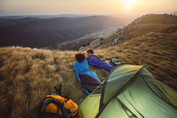istock Two Young Women Camping on Top of Hill 937285406