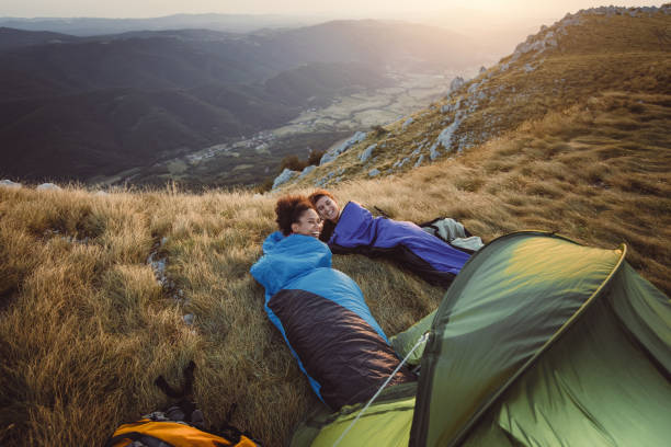 istock Two Young Women Camping on Top of Hill 937285410
