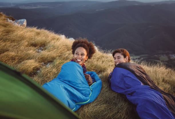 istock Two Young Women Camping on Top of Hill 937285458