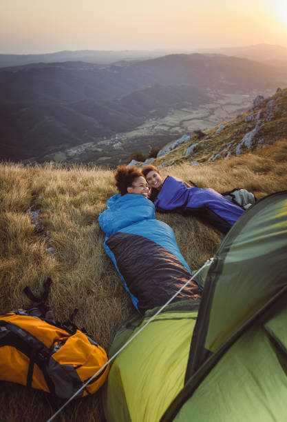 istock Two Young Women Camping on Top of Hill 937285470