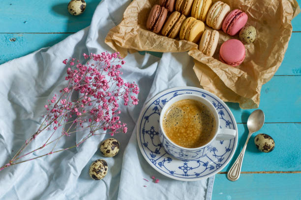 istock Macaroons and coffee. Blue, rose and baige colors. 937285778