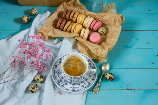 istock Macaroons and coffee. Blue, rose and baige colors. 937285846