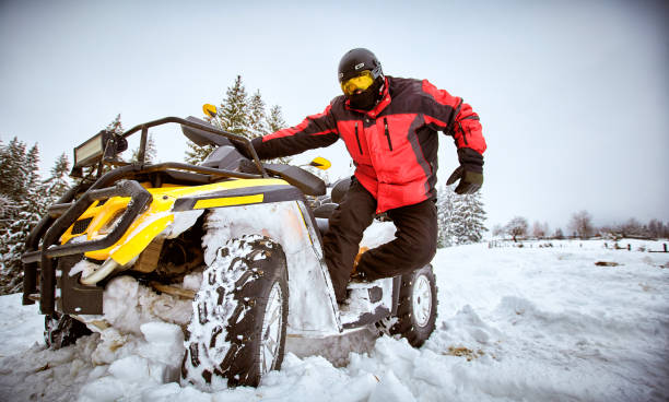istock Winter race on an ATV on snow in the forest. 937285854