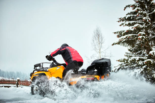 istock Winter race on an ATV on snow in the forest. 937285856