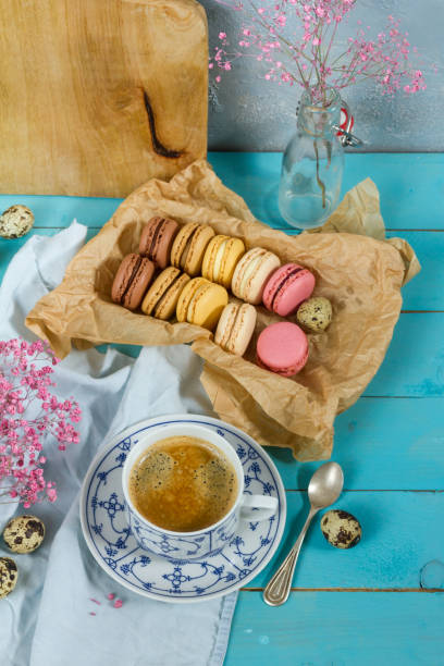 istock Macaroons and coffee. Blue, rose and baige colors. 937286026