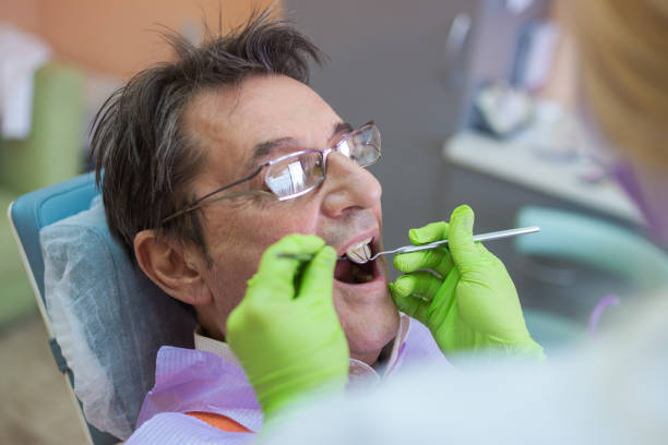 istock Senior Man At Dentist Office 937286312