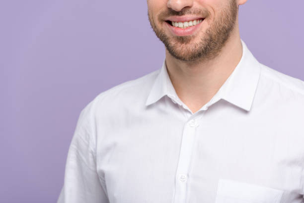 istock Cropped view of young man isolated on violet 937286798