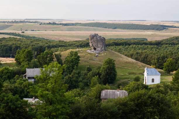 istock View to Devil's rock in Pidkamin, Lviv region, West Ukraine (summer landscape) 937295378