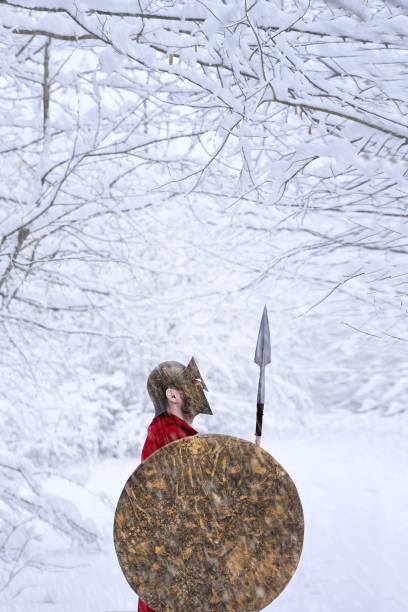 istock Spartan warrior stands in snowy forest. 937295720