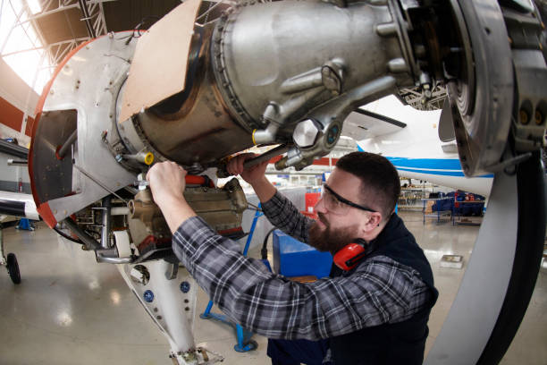 istock Aircraft mechanic in the hangar 937298198