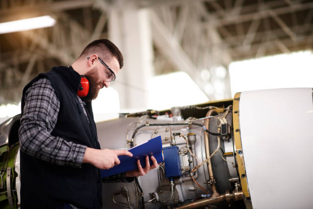 istock Aircraft mechanic in the hangar 937298286