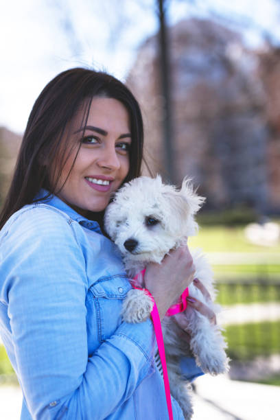 istock Happy lady with little puppy 937298380