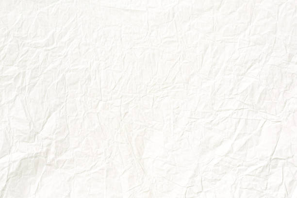 Crumpled old pale yellow paper texture