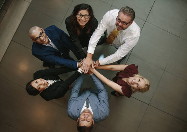 istock Diverse business team showing unity 937302600