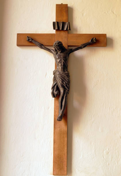 istock Crucifix on wall of old church 937312262